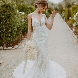 GLAMOROUS LACE FIT-AND-FLARE WEDDING GOWN WITH PLUNGING NECKLINE